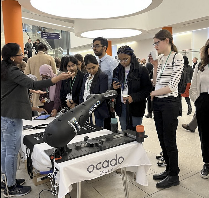 Students at the Ocado Technology stand